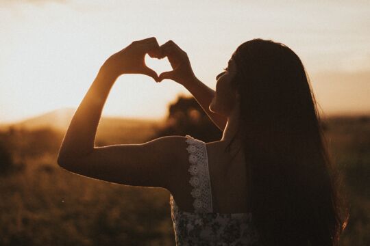 Woman making a heart with her hands