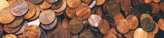 Pennies spilled out of a jar